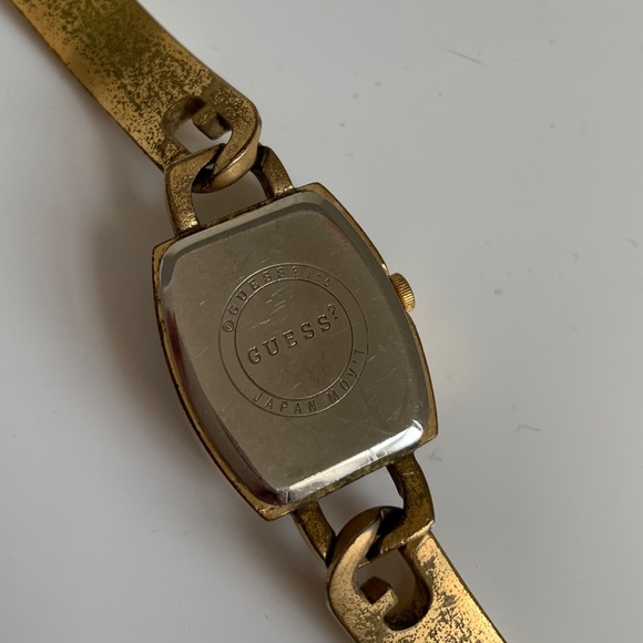 Guess interlocking G skinny gold watch